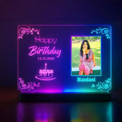 Personalized birthday LED light frame with a photo of a woman and men celebratory text.